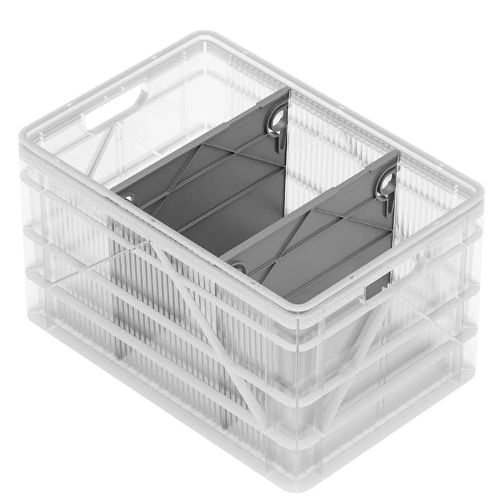 Clear plastic SidioCrate storage bin for camper van organization.