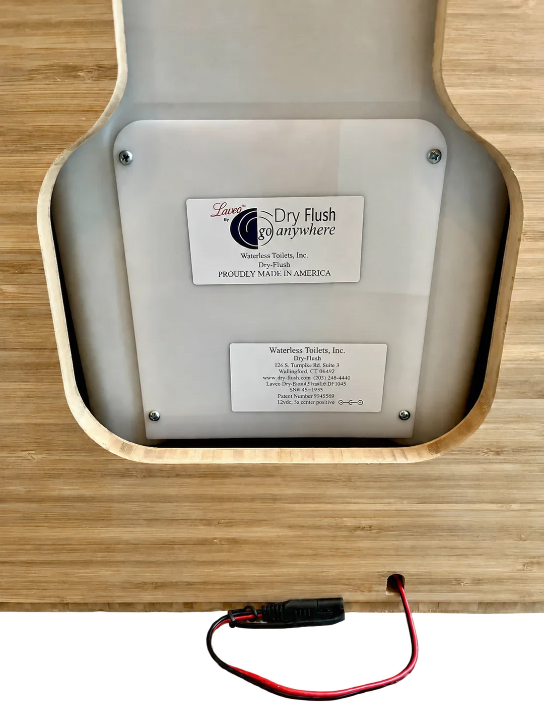 White Laveo Dry Flush toilet panel mounted inside a bamboo Weekender Outdoors cabinet.